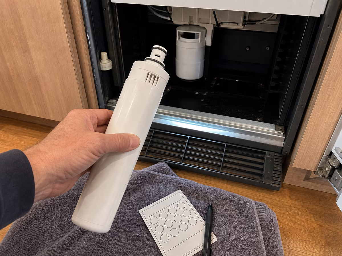 Sub-Zero water filter being replaced by an owner as routine maintenance